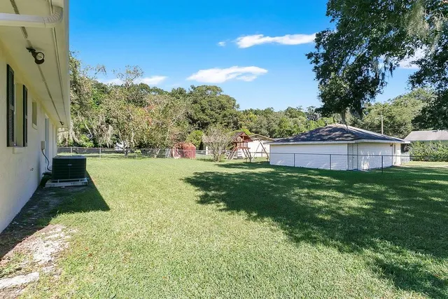 a view of backyard with green space