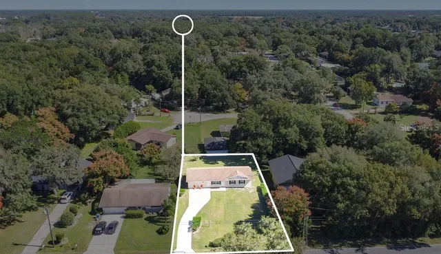 an aerial view of house with a swimming pool