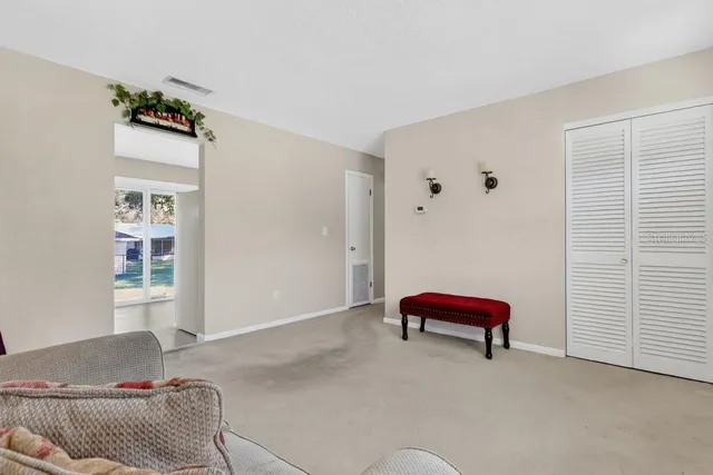 a living room with furniture and a window