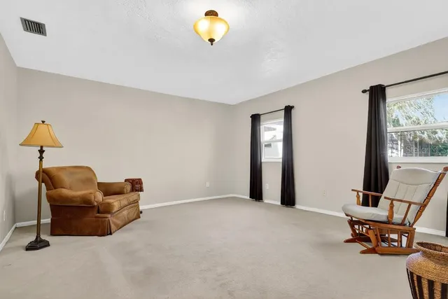 a view of workspace with furniture and window