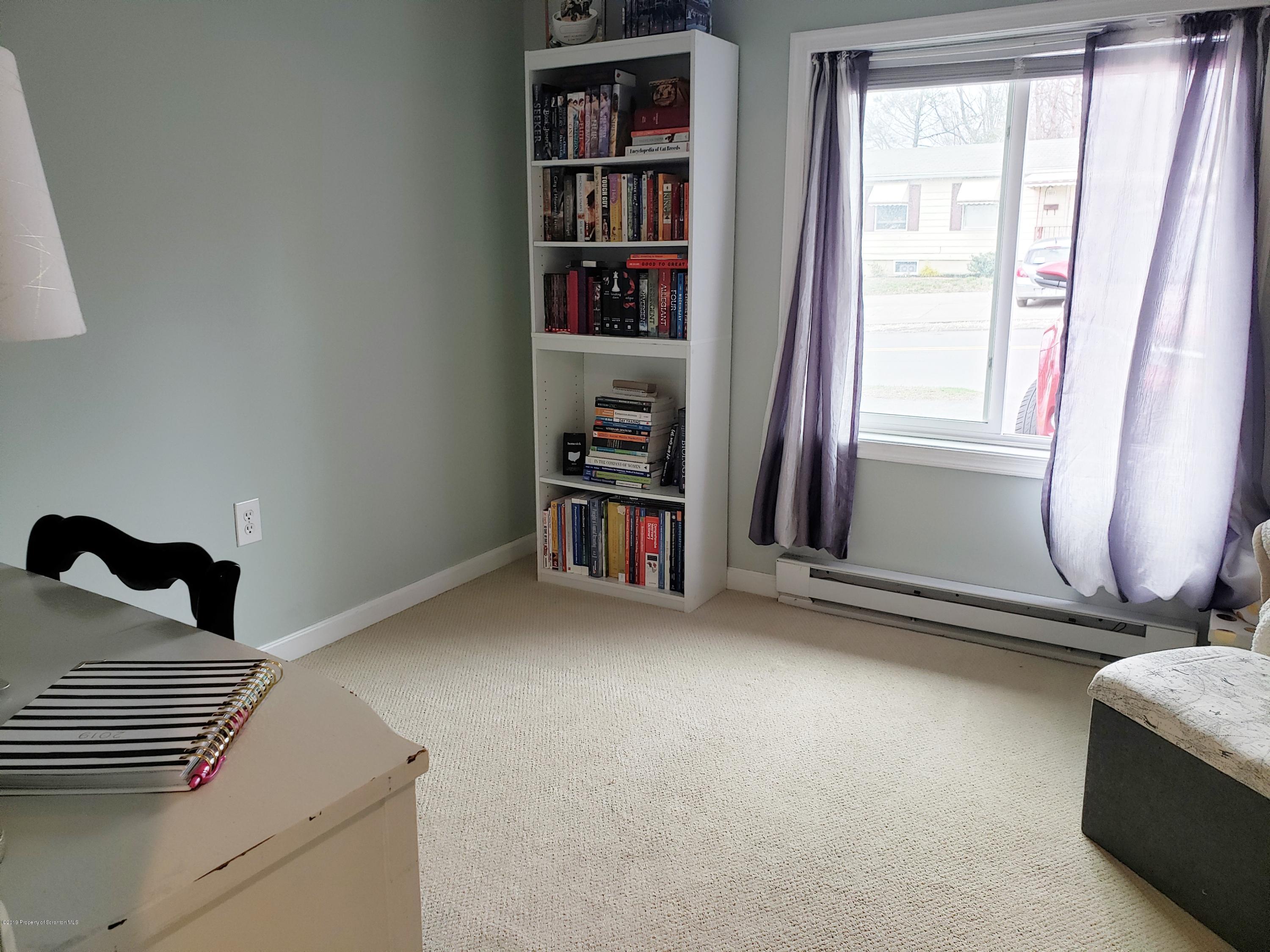 1816 Green Ridge Street Dunmore, PA 18509 - Photo 15 of 30 a view of an empty room with stairs and a window