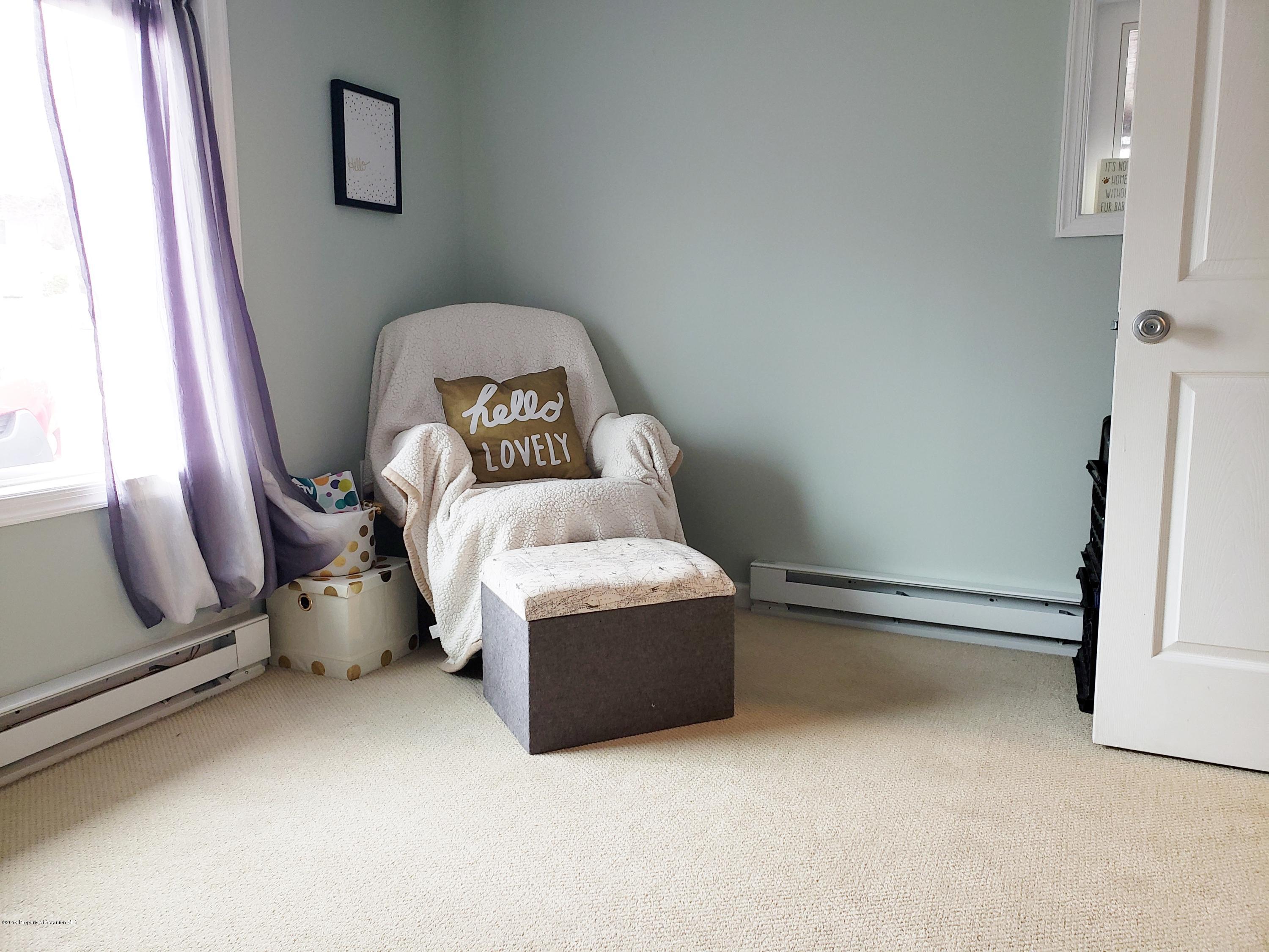 1816 Green Ridge Street Dunmore, PA 18509 - Photo 16 of 30 a room with a couch and mirror