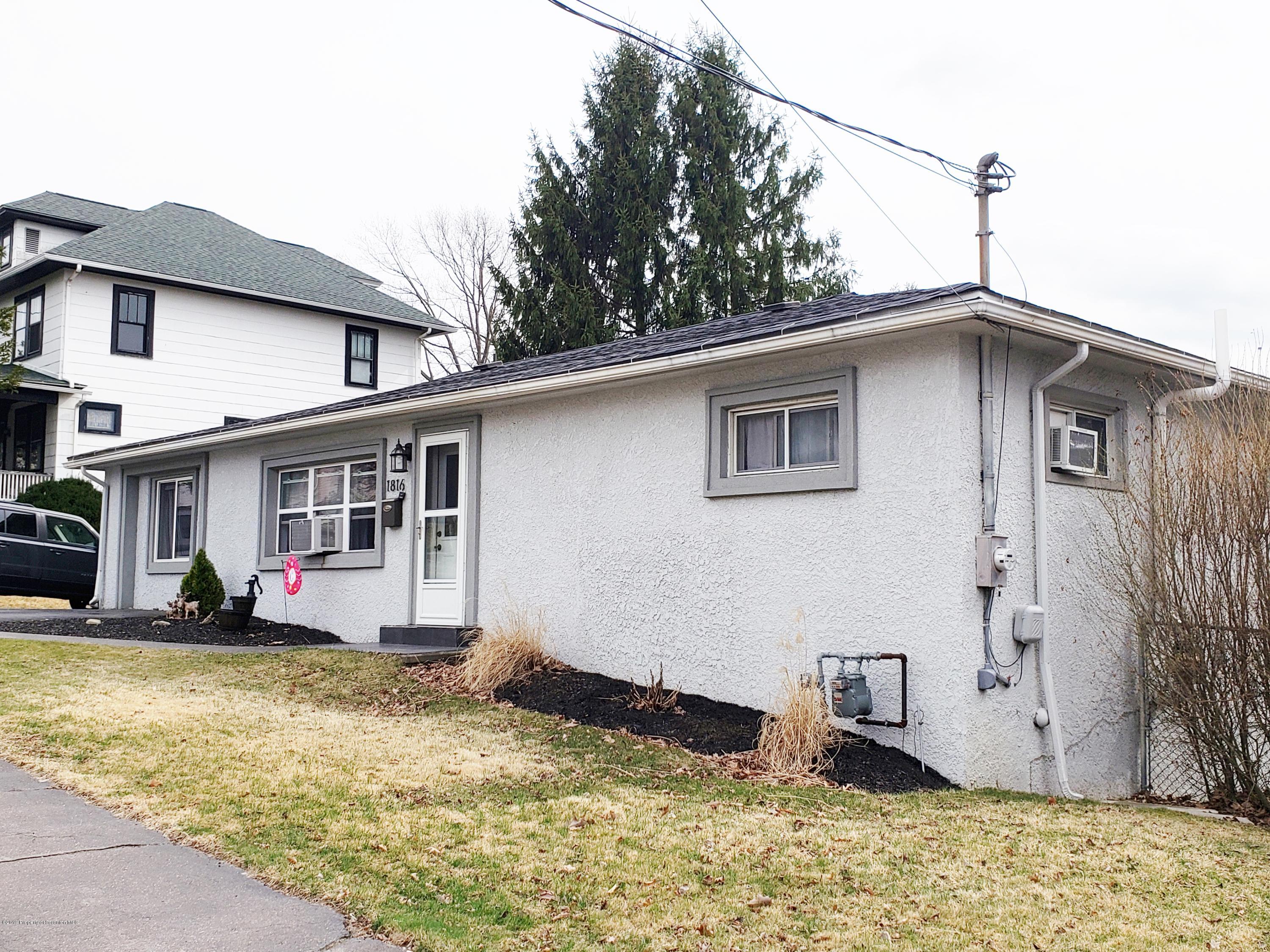 1816 Green Ridge Street Dunmore, PA 18509 - Photo 2 of 30 a house view with a garden space