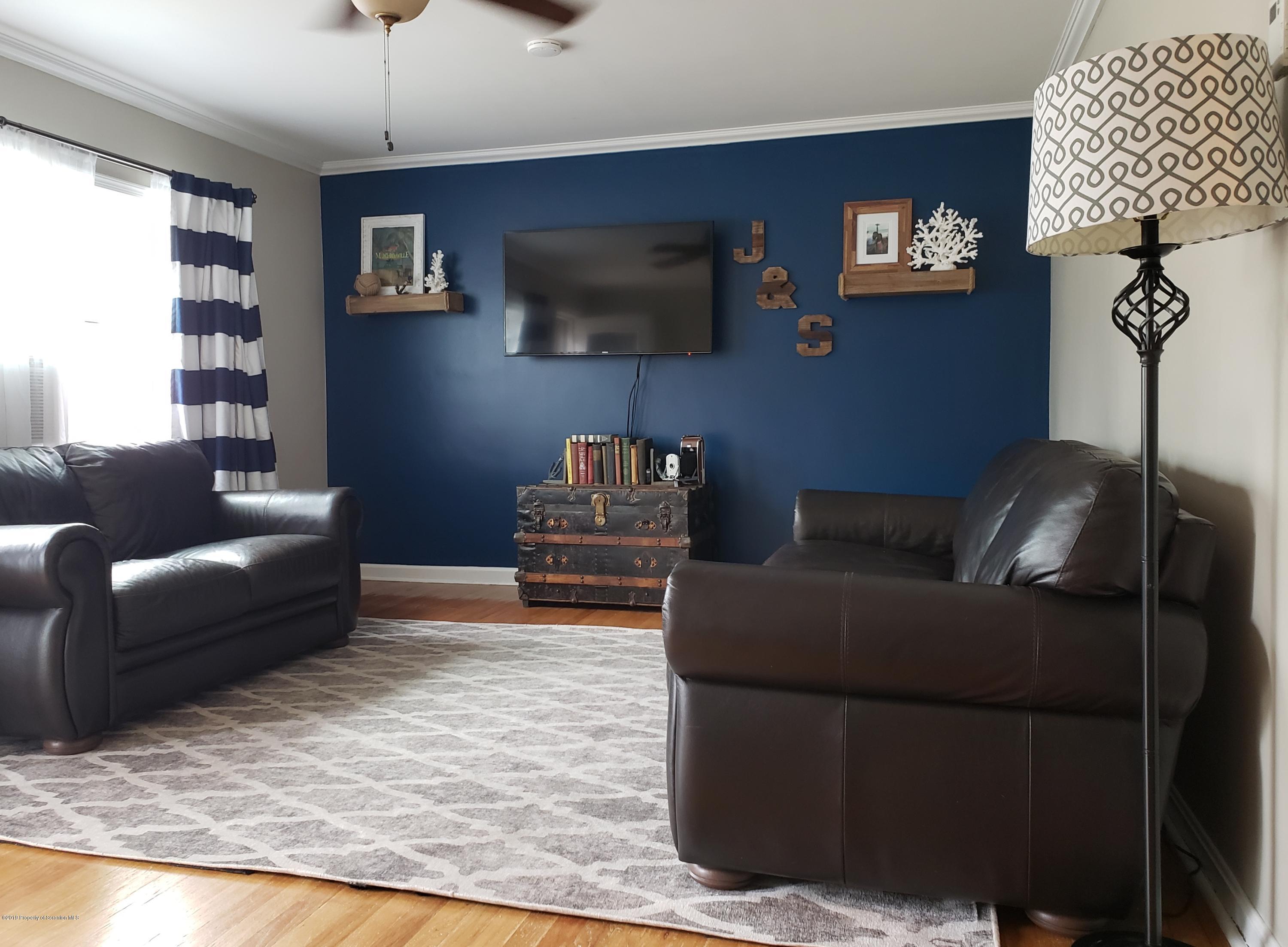 1816 Green Ridge Street Dunmore, PA 18509 - Photo 3 of 30 a living room with furniture and a flat screen tv