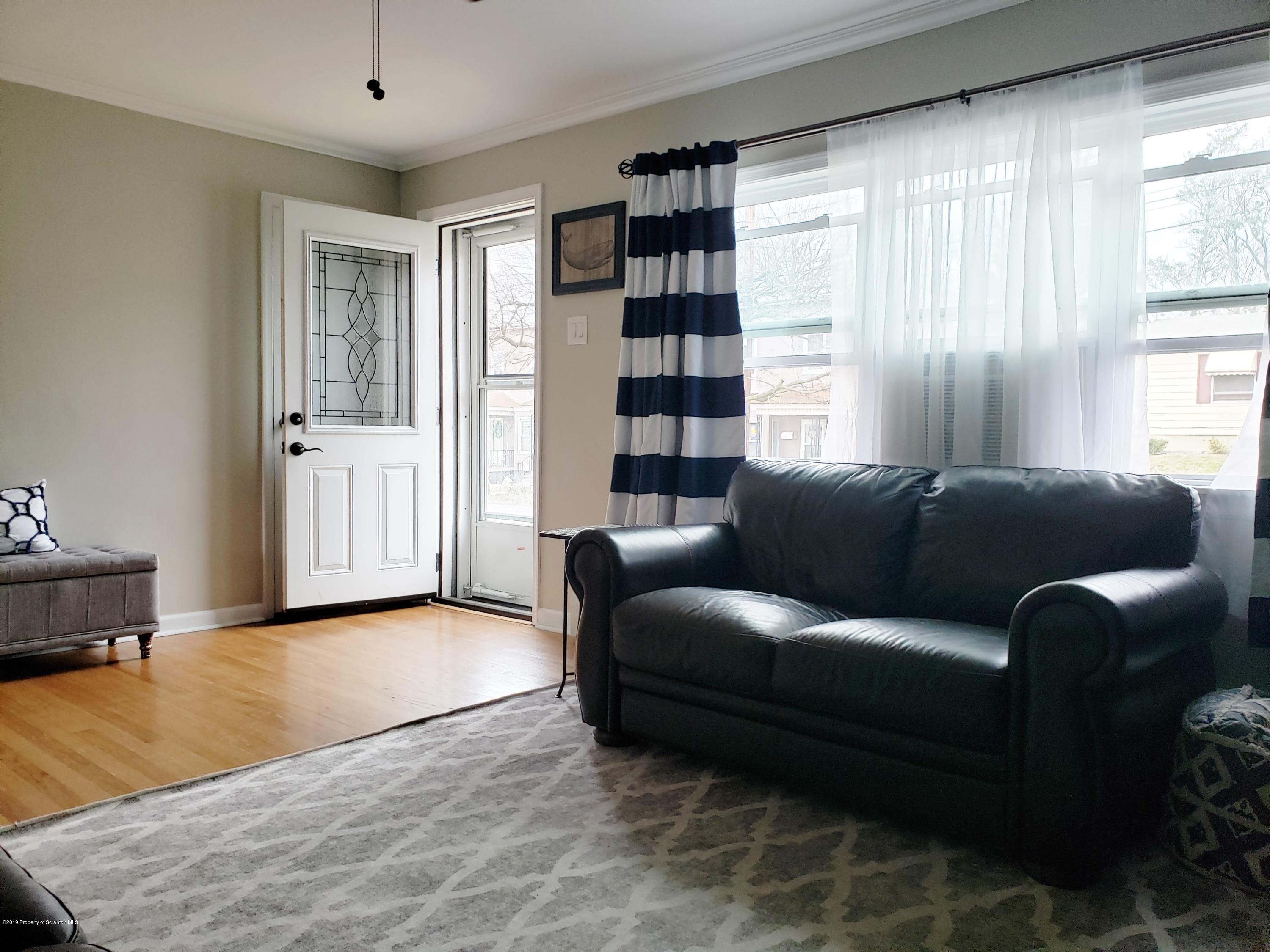 1816 Green Ridge Street Dunmore, PA 18509 - Photo 4 of 30 a living room with furniture and a large window