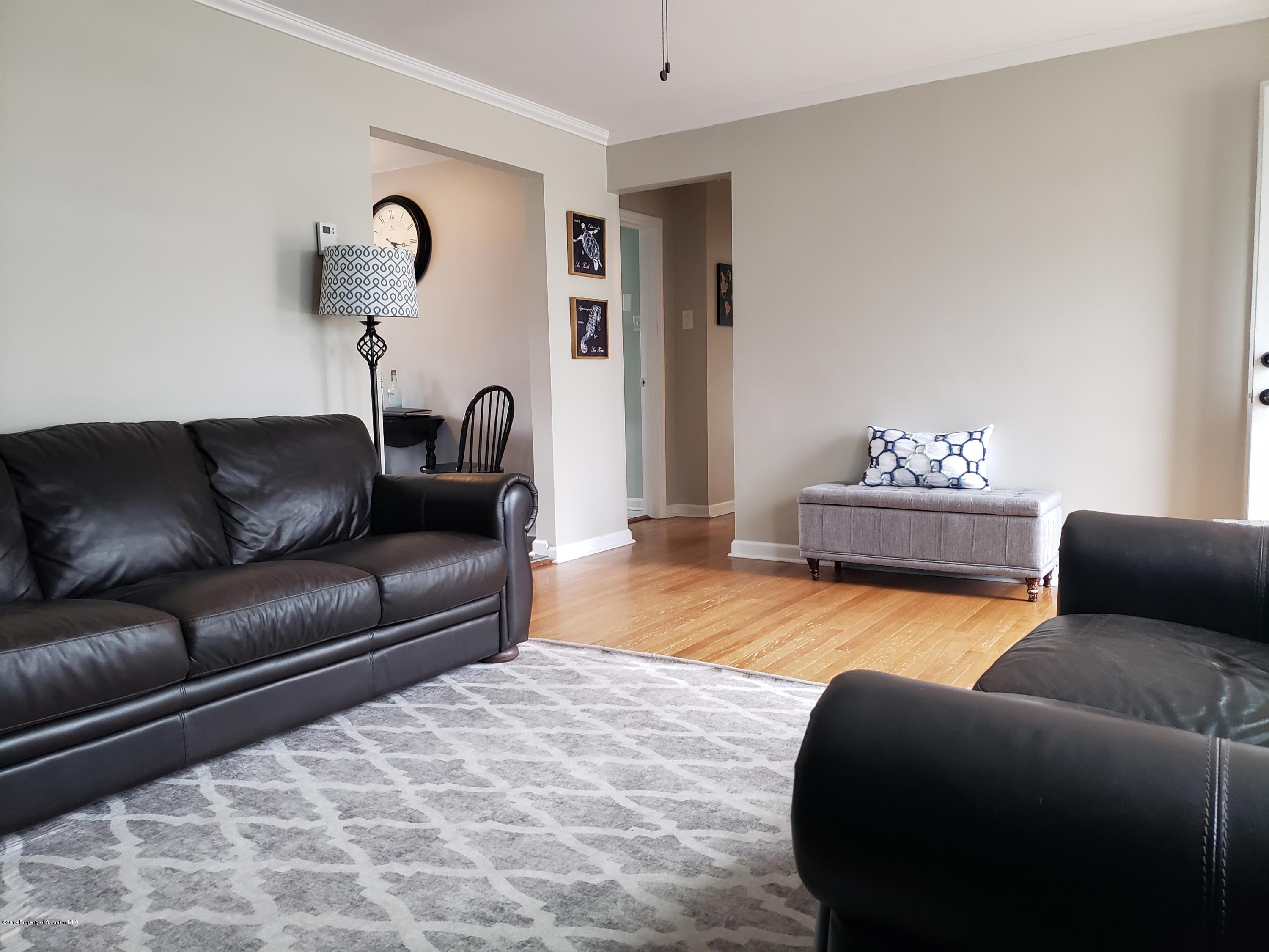 1816 Green Ridge Street Dunmore, PA 18509 - Photo 5 of 30 a living room with furniture and a couch