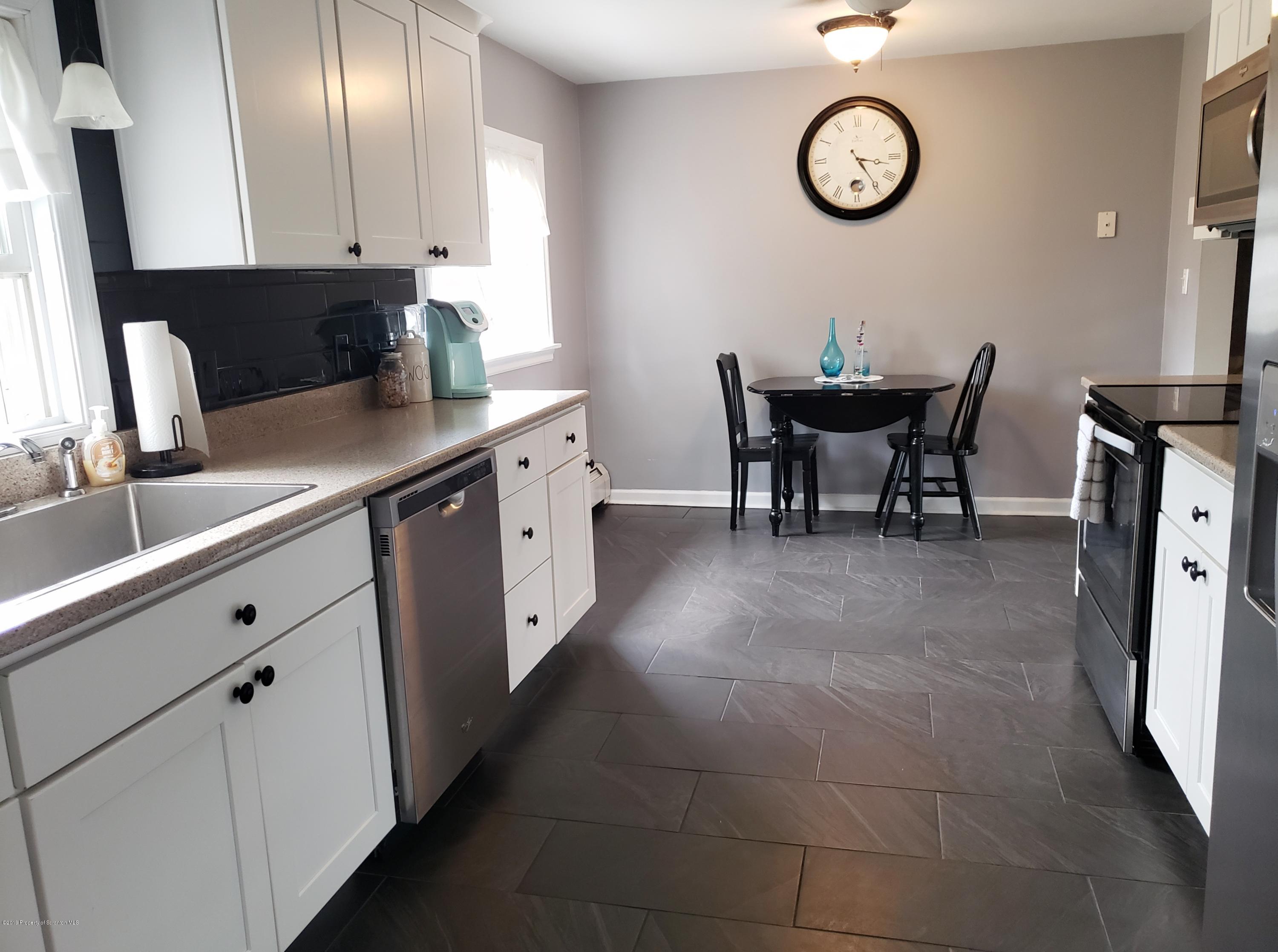 1816 Green Ridge Street Dunmore, PA 18509 - Photo 8 of 30 a kitchen with a sink cabinets and window