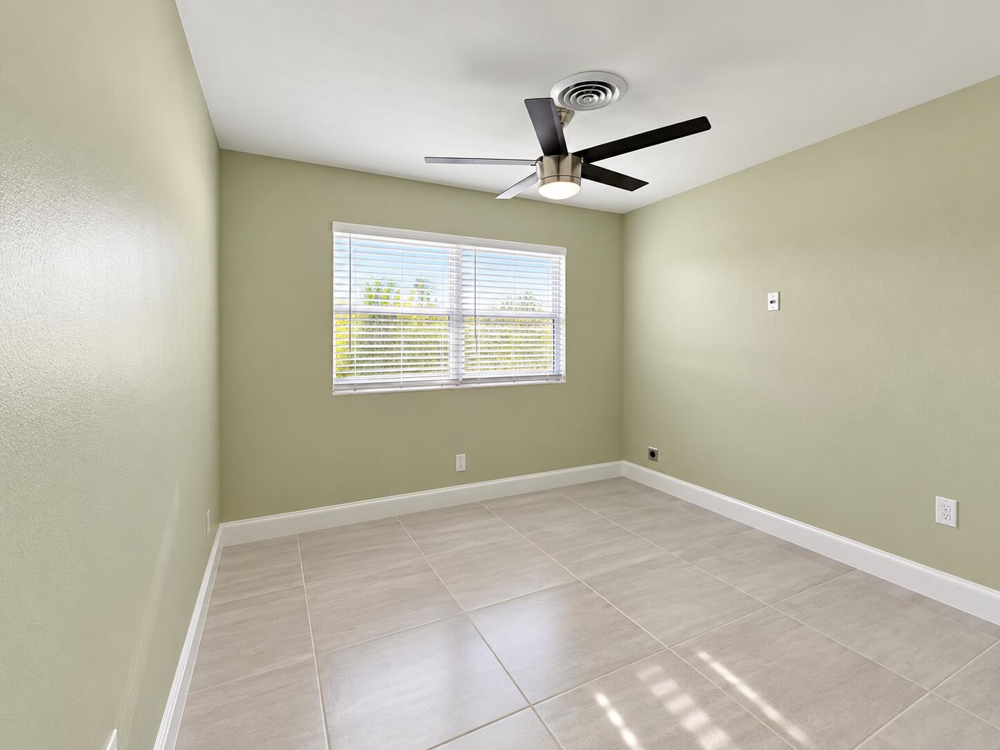 266 Southwest 12th Street Boca Raton, FL 33432 - Photo 16 of 30 Minimal Sage Bedroom with Fan and Window