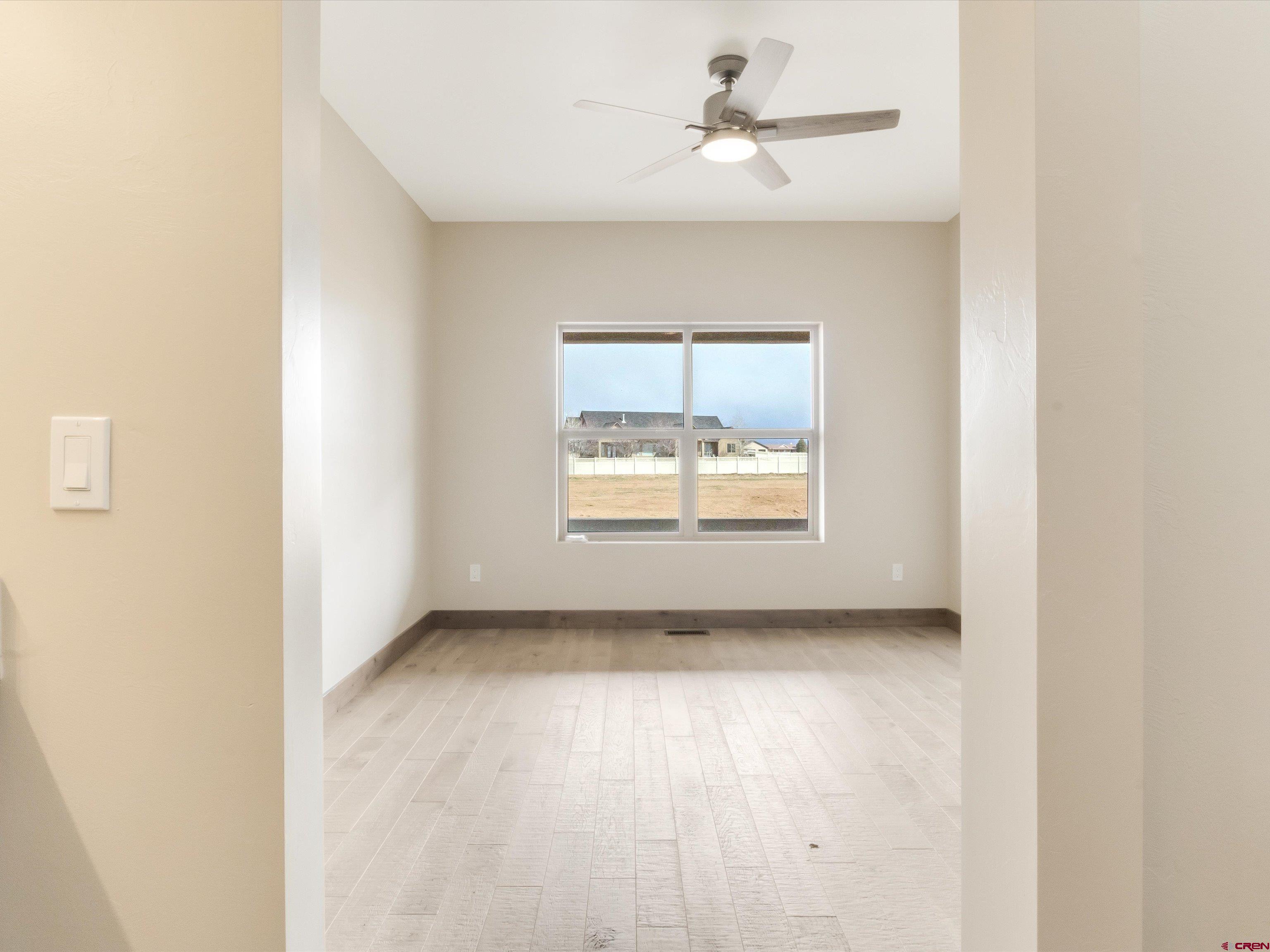 1900 Snaffle Bit Road Delta, CO 81416 - Photo 28 of 33 an empty room with a empty space and windows