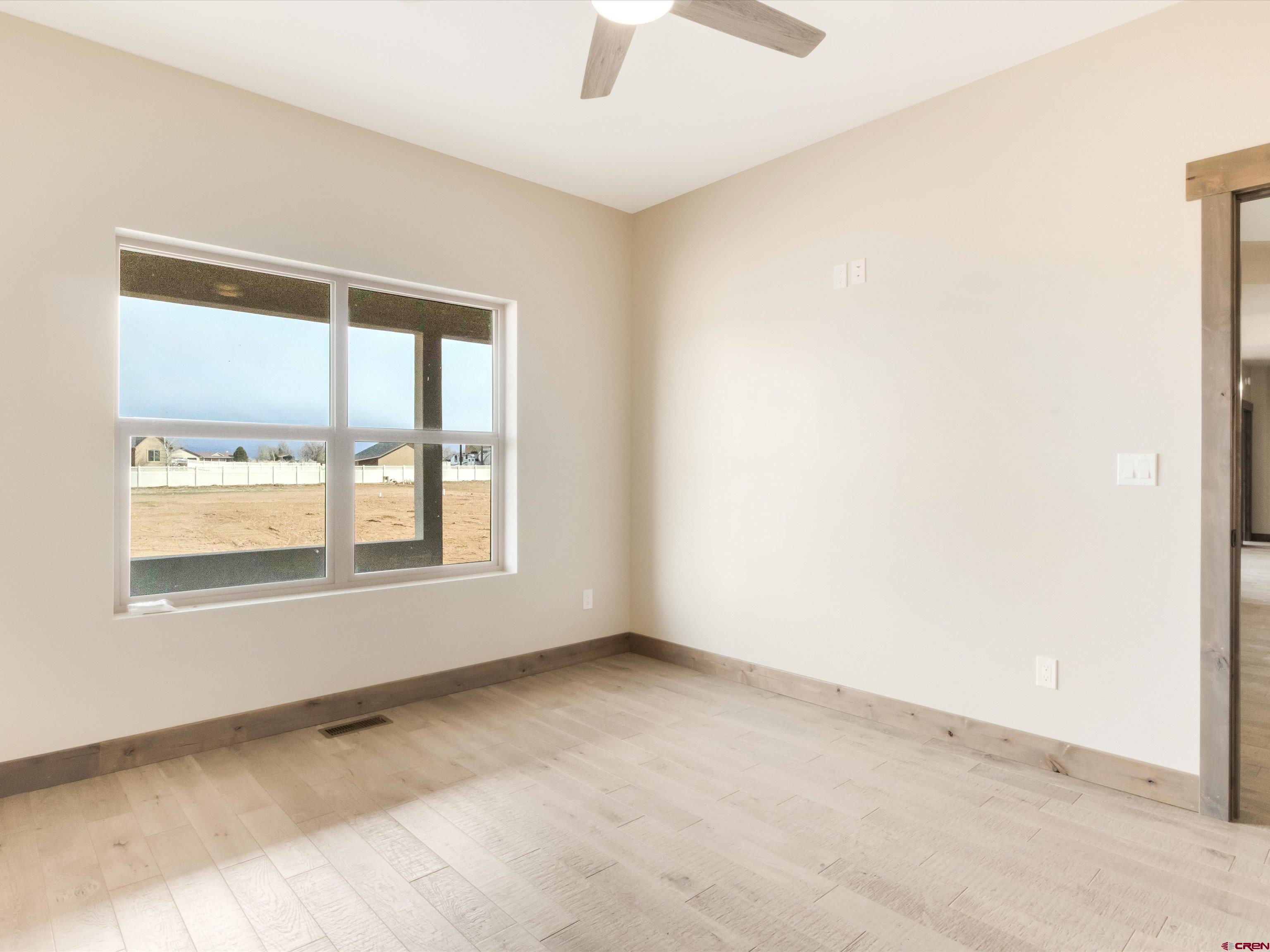 1900 Snaffle Bit Road Delta, CO 81416 - Photo 29 of 33 an empty room with a window