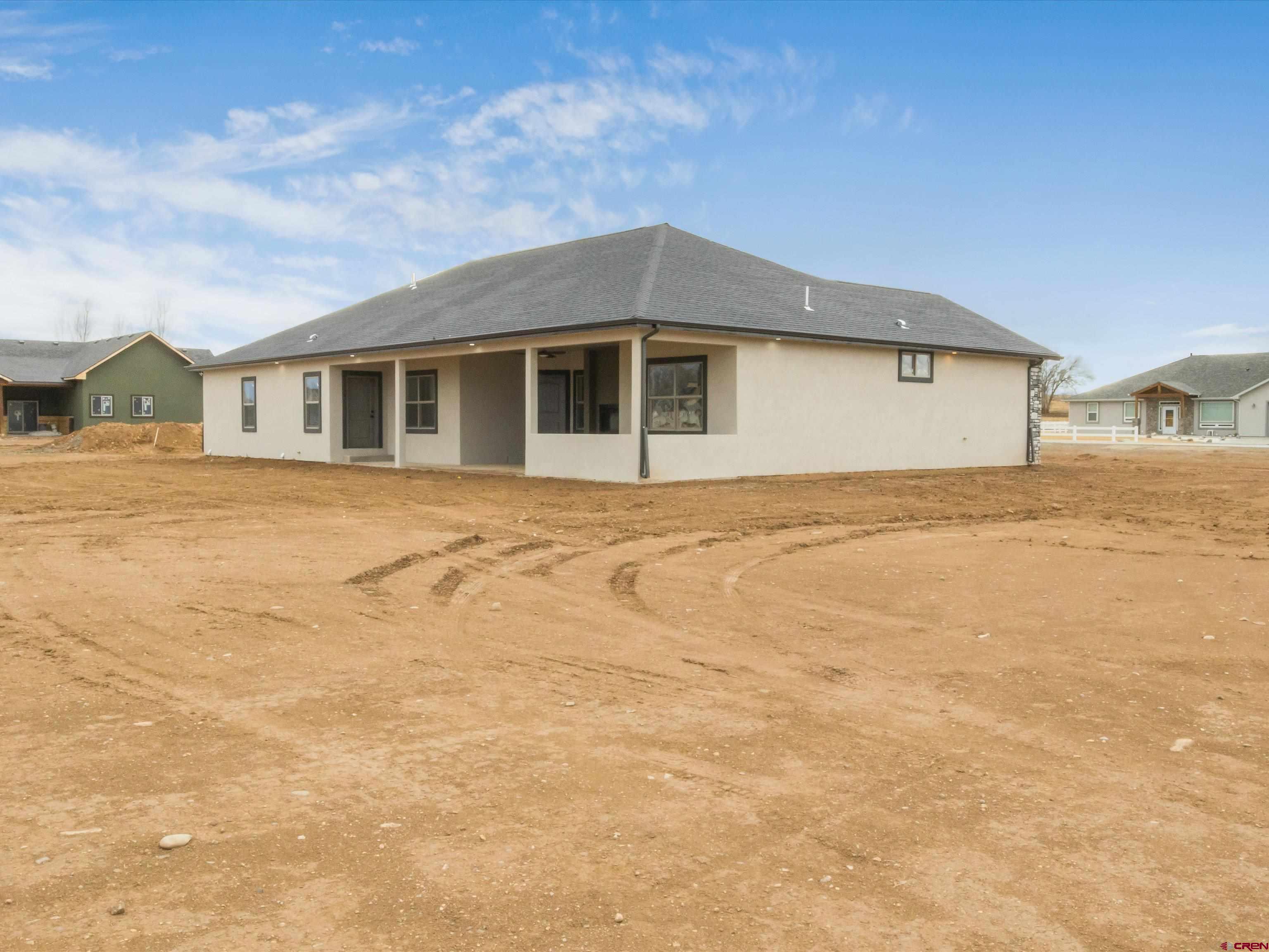 1900 Snaffle Bit Road Delta, CO 81416 - Photo 33 of 33 a front view of a house with a yard