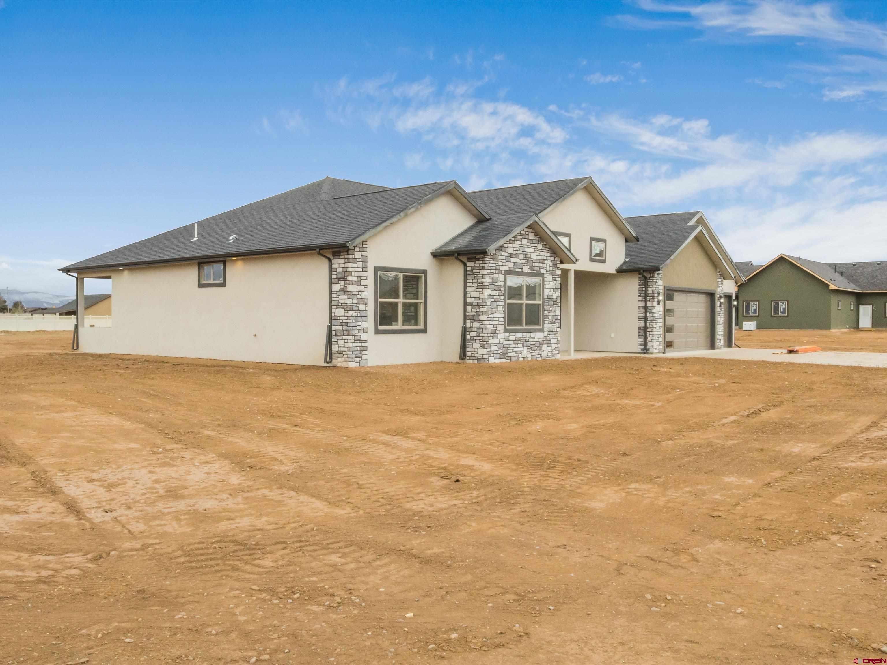 1900 Snaffle Bit Road Delta, CO 81416 - Photo 5 of 33 a front view of a house with a yard