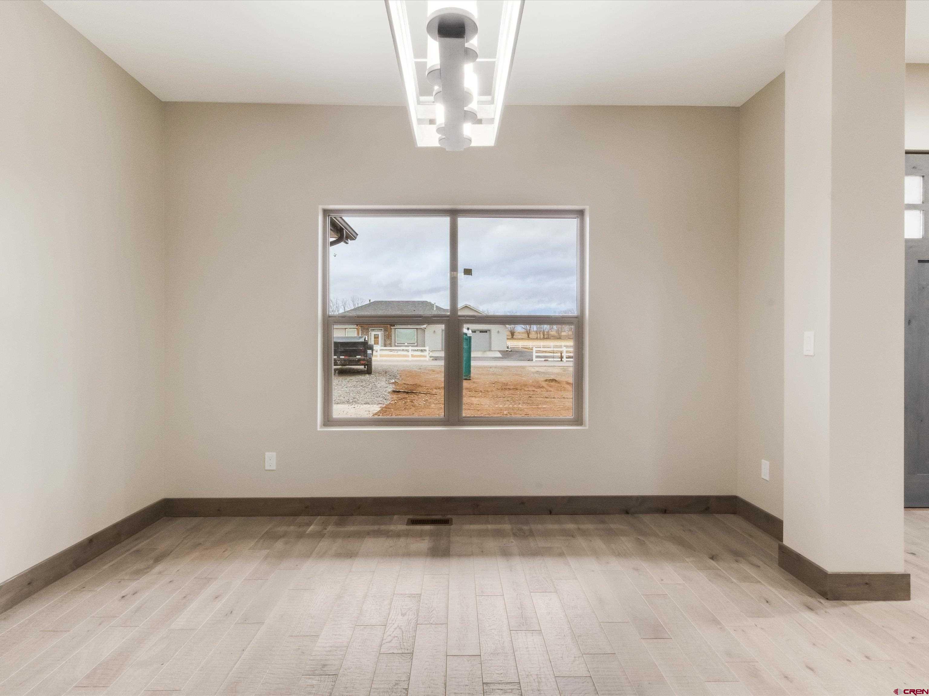 1900 Snaffle Bit Road Delta, CO 81416 - Photo 8 of 33 an empty room with a window