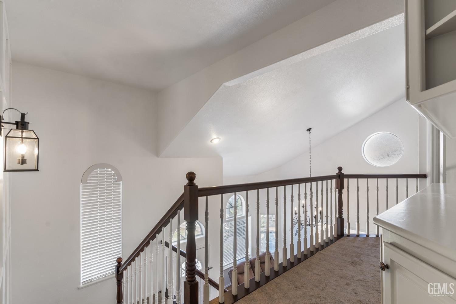 Undisclosed Address Bakersfield, CA 93312 - Photo 16 of 29 a view of staircase with railing and white walls