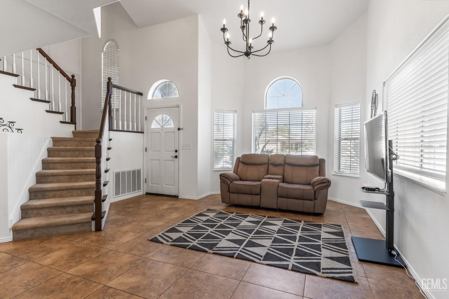 Undisclosed Address Bakersfield, CA 93312 - Photo 4 of 29 a living room with furniture and wooden floor