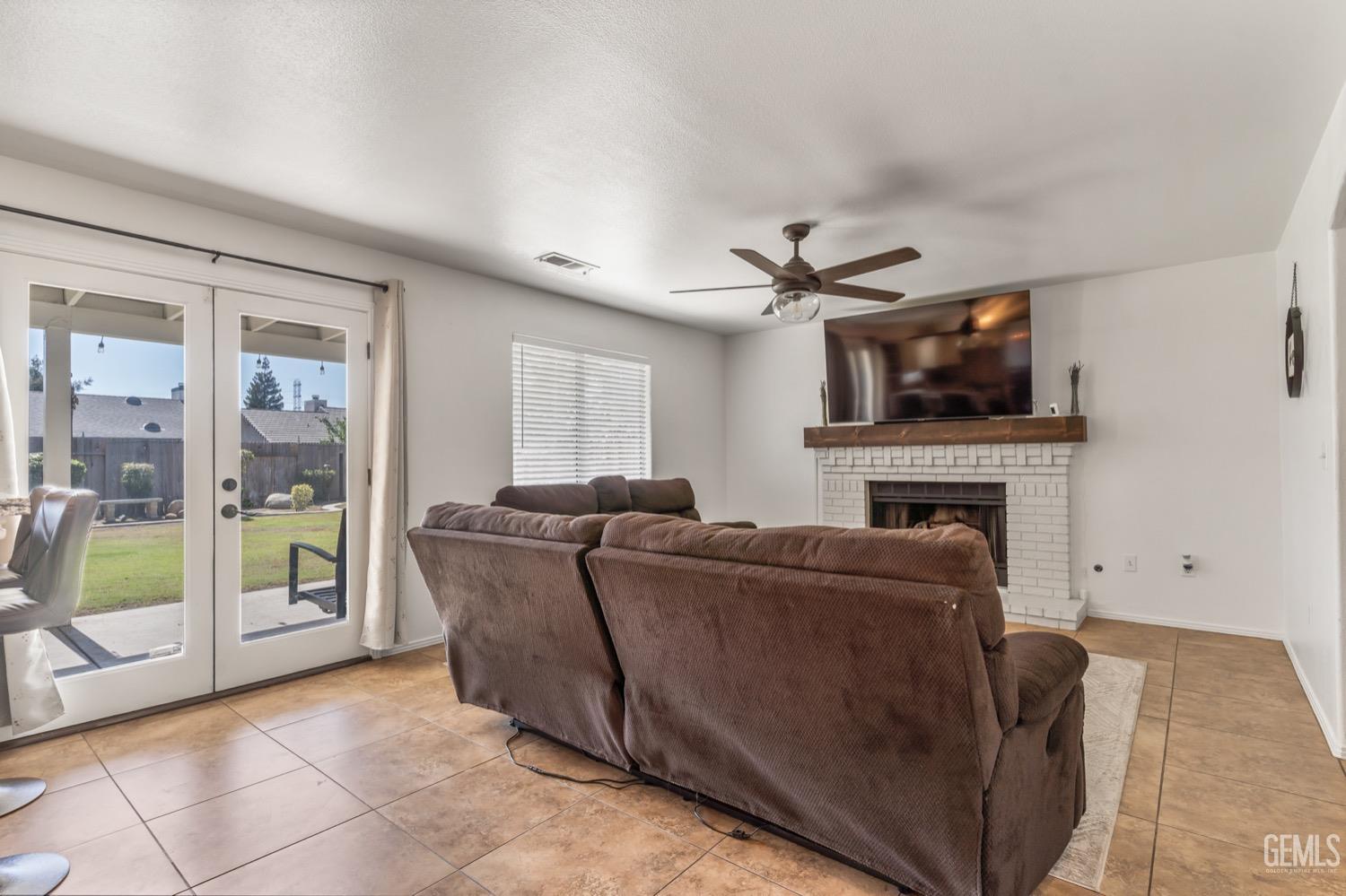Undisclosed Address Bakersfield, CA 93312 - Photo 9 of 29 a living room with furniture and a flat screen tv