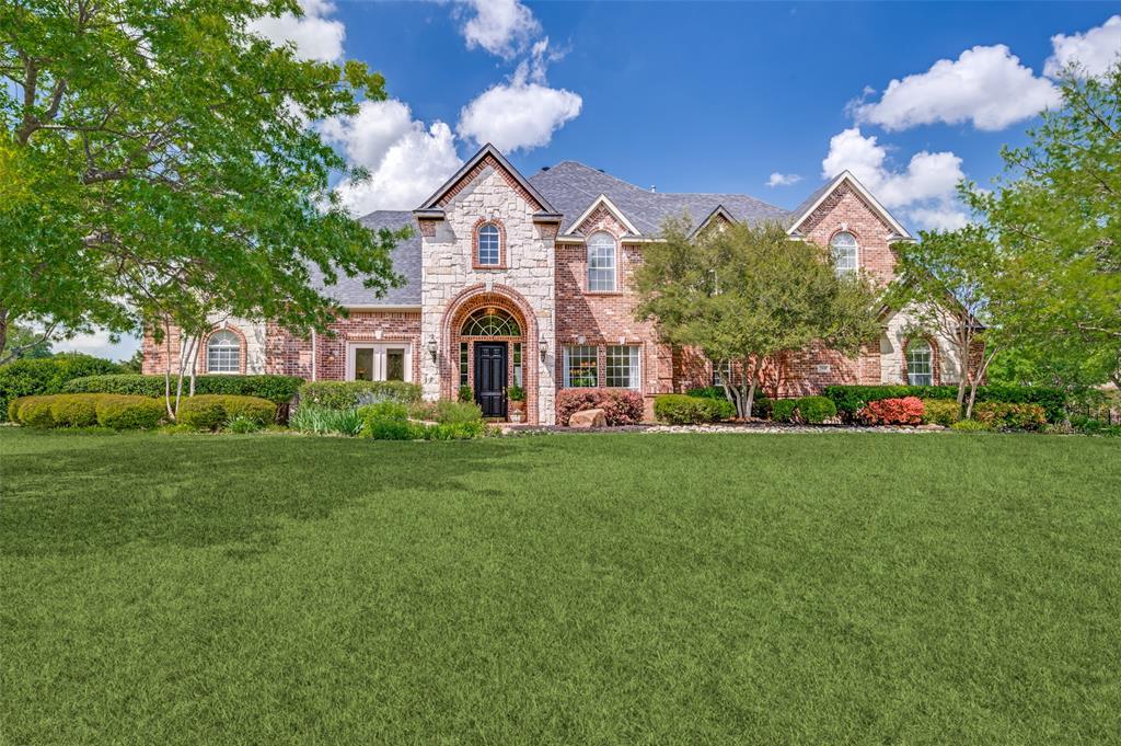 2841 Winding Creek Road Prosper, TX 75078 - Photo 2 of 40 a front view of a house with a yard