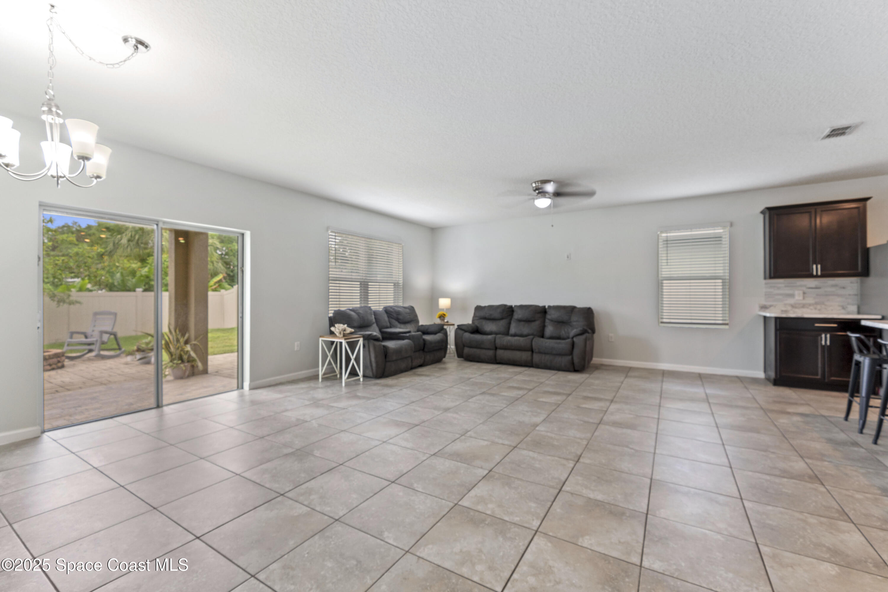 310 Forest Trace Circle Titusville, FL 32780 - Photo 11 of 36 a view of a livingroom with furniture and window
