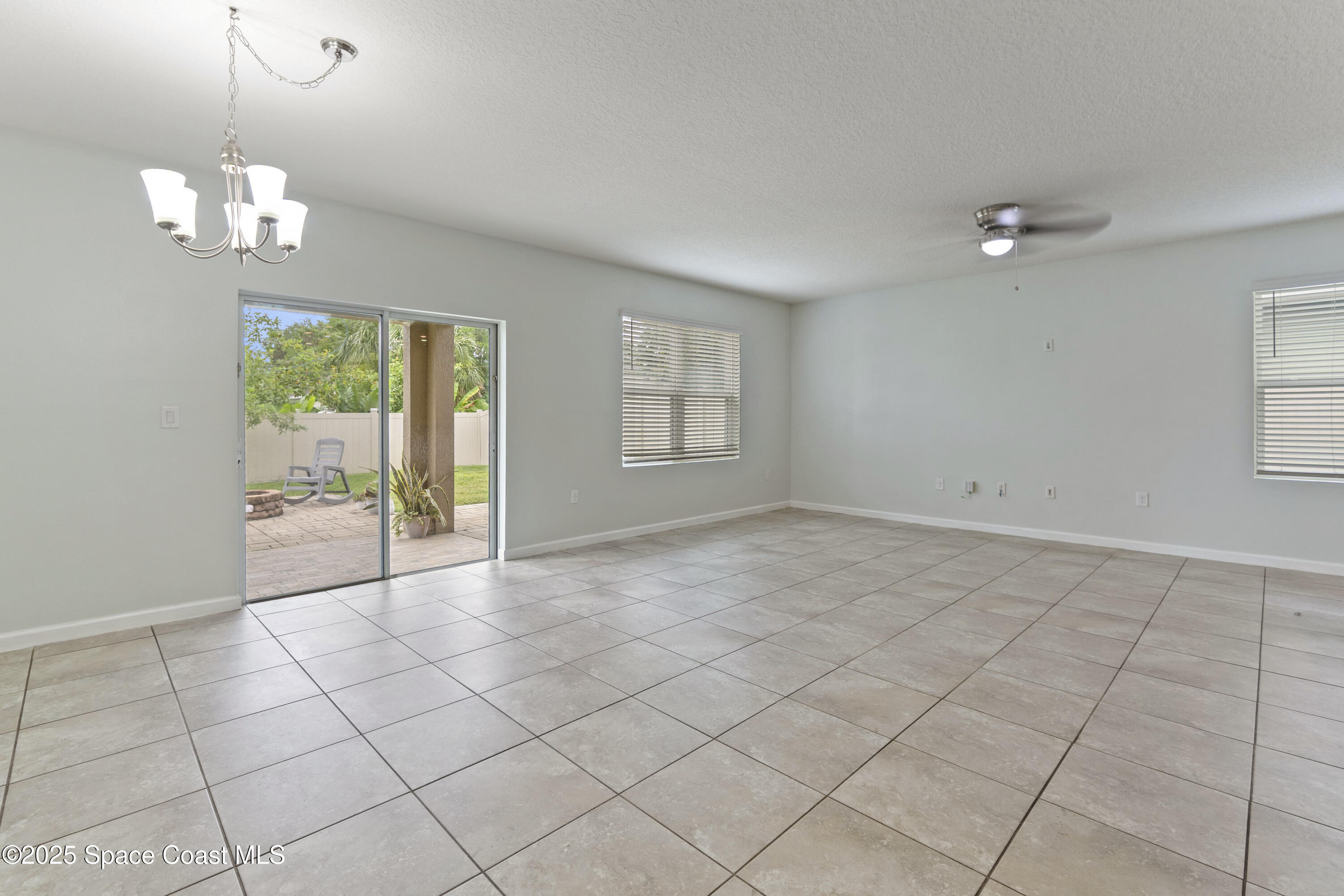 310 Forest Trace Circle Titusville, FL 32780 - Photo 12 of 36 a view of an empty room with a window