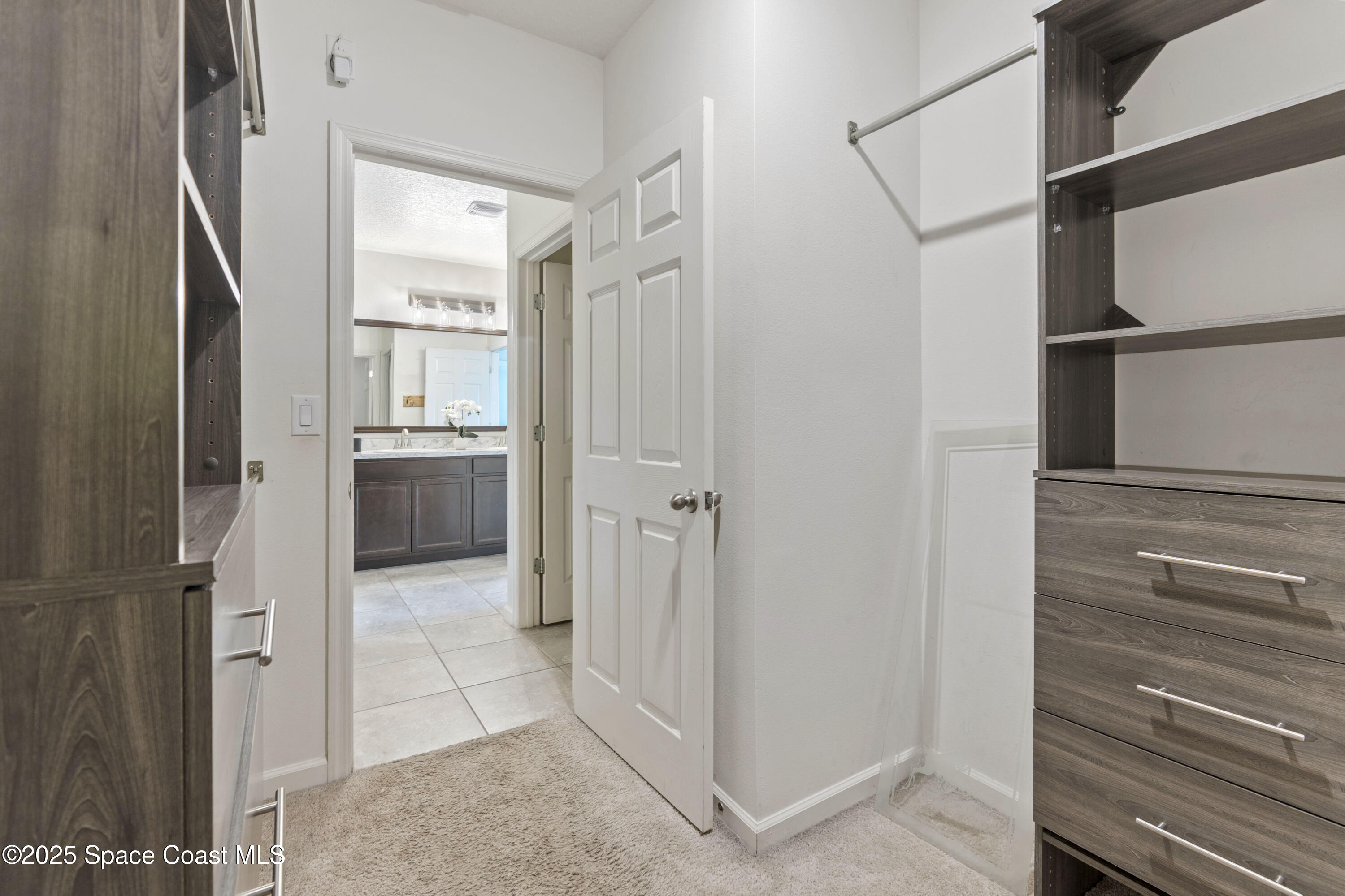 310 Forest Trace Circle Titusville, FL 32780 - Photo 20 of 36 a view of walk in closet
