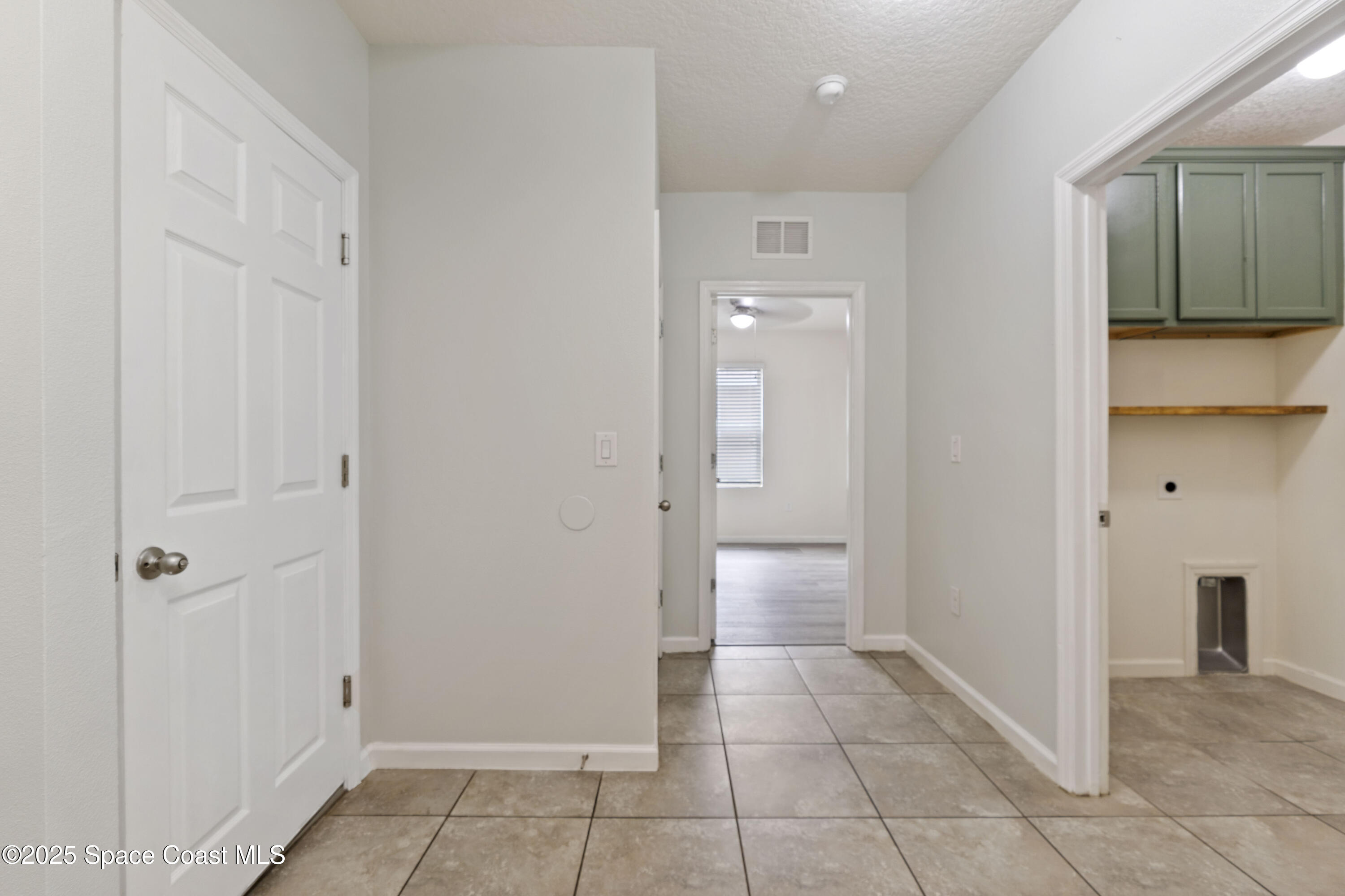 310 Forest Trace Circle Titusville, FL 32780 - Photo 23 of 36 a view of a hallway with closet and a bathroom