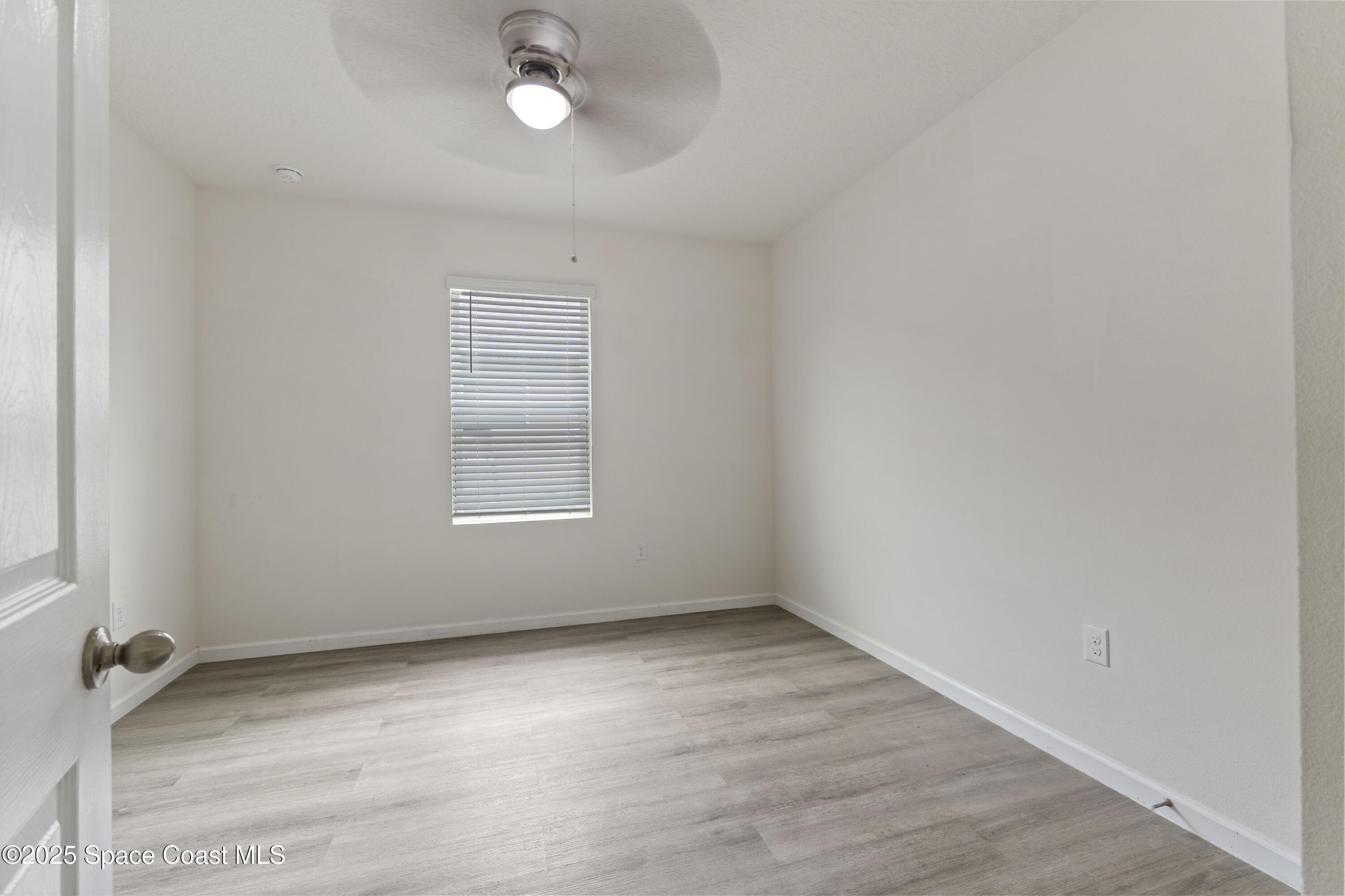 310 Forest Trace Circle Titusville, FL 32780 - Photo 24 of 36 an empty room with a empty space and a window