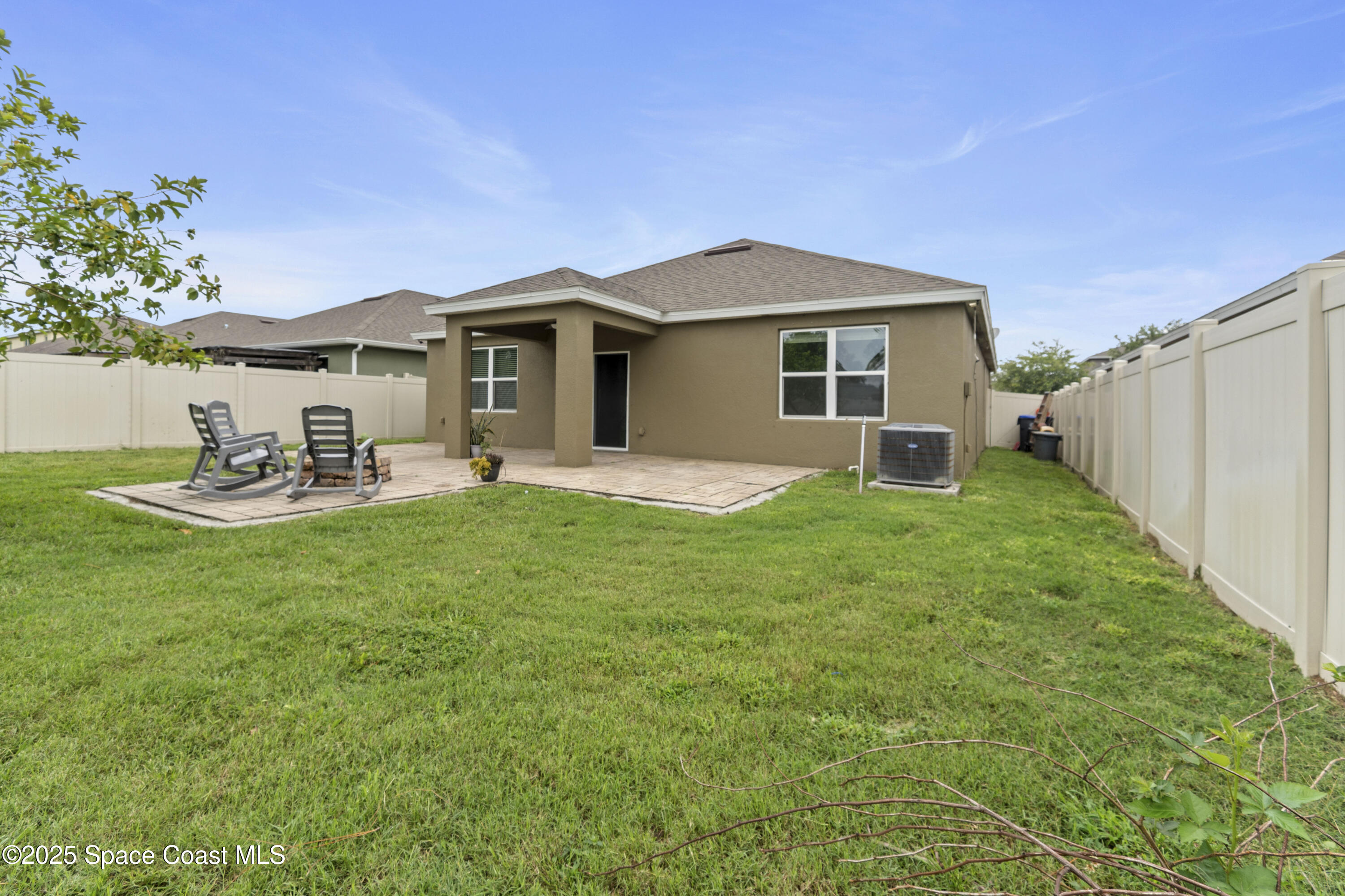 310 Forest Trace Circle Titusville, FL 32780 - Photo 33 of 36 a front view of a house with garden