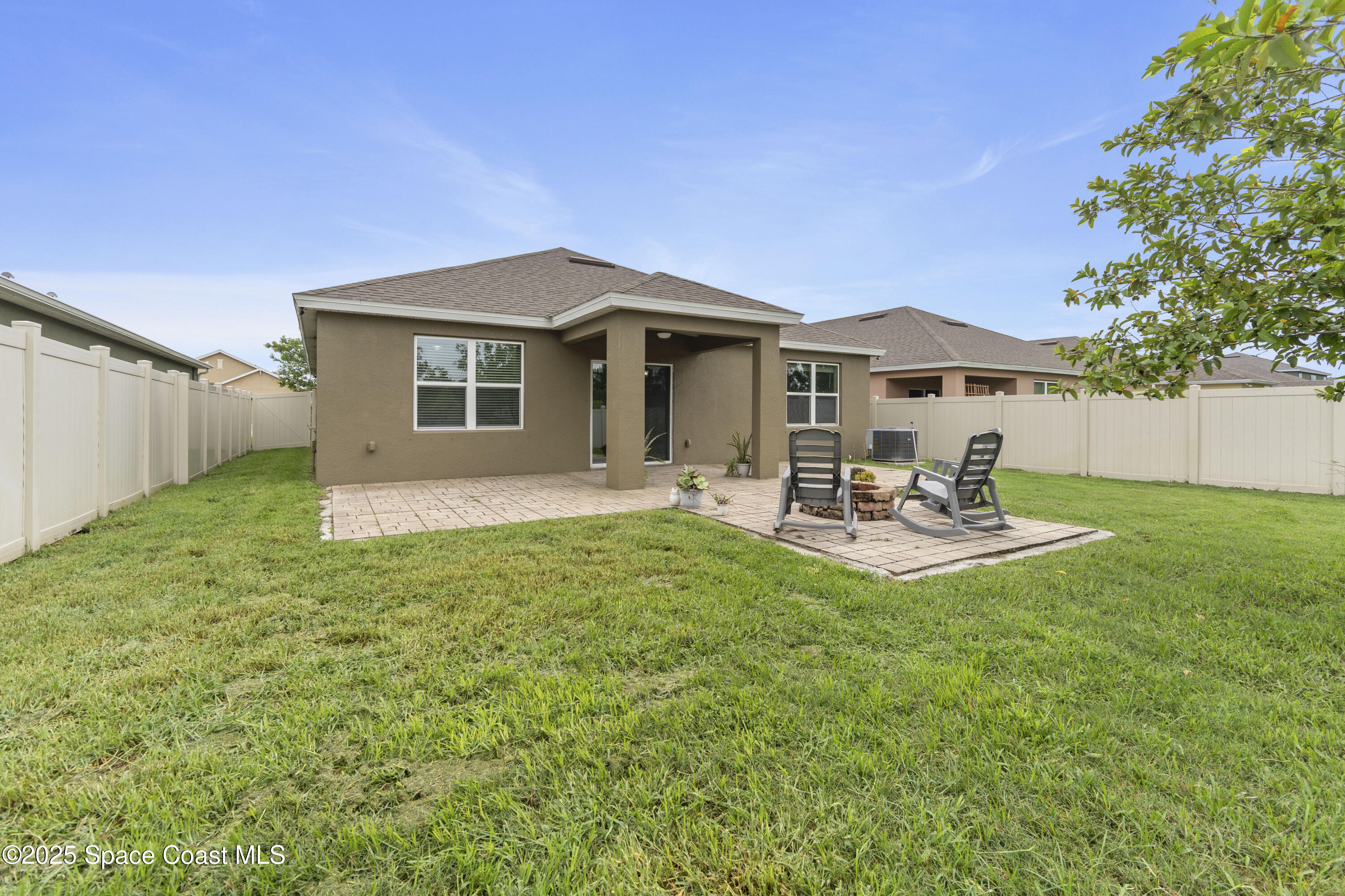 310 Forest Trace Circle Titusville, FL 32780 - Photo 34 of 36 a house view with a garden space