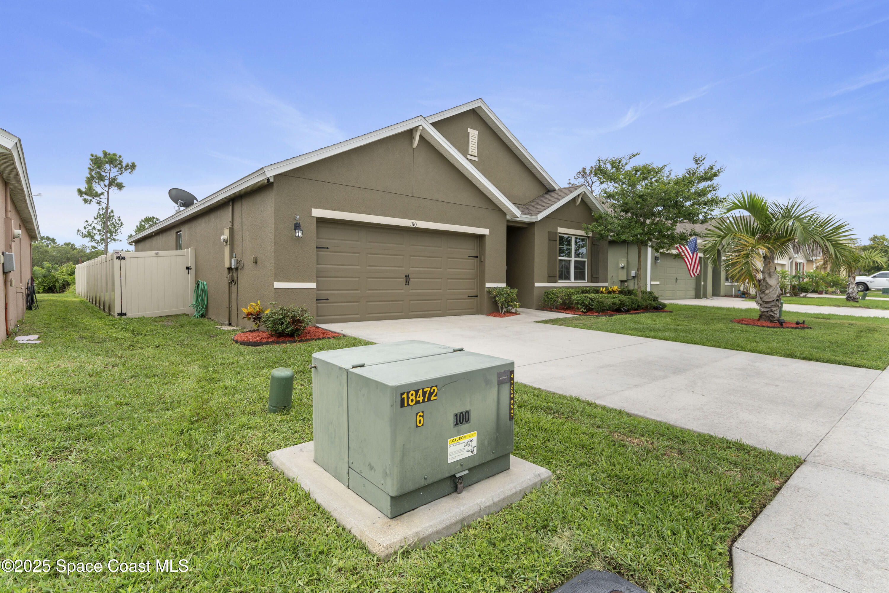 310 Forest Trace Circle Titusville, FL 32780 - Photo 4 of 36 a front view of house with yard and green space