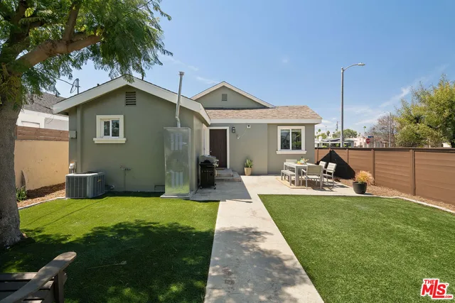 a view of a backyard with potted plants