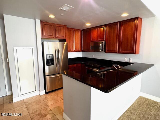 50 North Sierra Street, Unit STE 905 Reno, NV 89501 - Photo 3 of 12 a kitchen with stainless steel appliances granite countertop a refrigerator and a sink