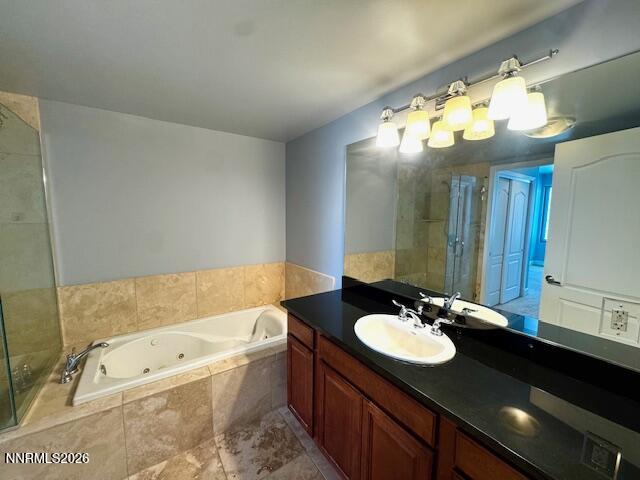50 North Sierra Street, Unit STE 905 Reno, NV 89501 - Photo 7 of 12 a bathroom with a granite countertop sink a large mirror and a bathtub
