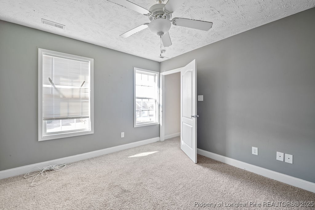 185 Sunflower Street Raeford, NC 28376 - Photo 25 of 30 a view of an empty room with a window
