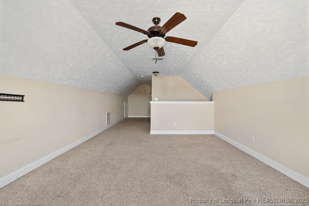 185 Sunflower Street Raeford, NC 28376 - Photo 27 of 30 an empty room with ceiling fan and window