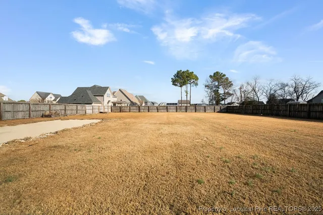 a view of ocean with large trees