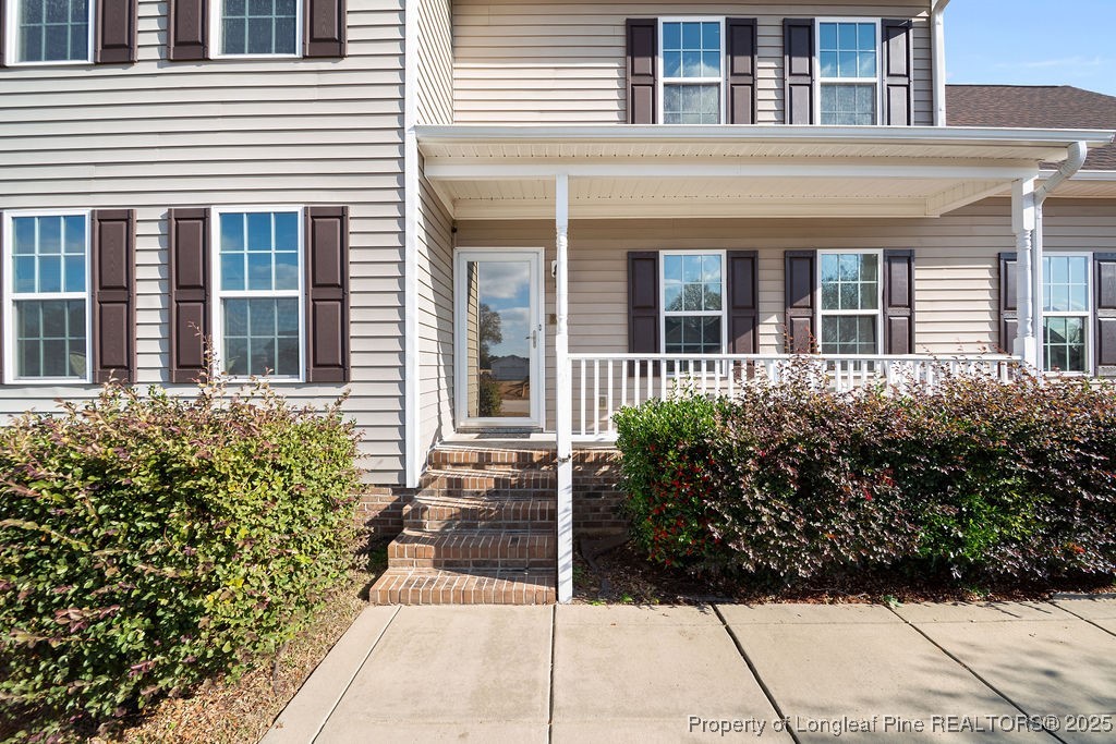 185 Sunflower Street Raeford, NC 28376 - Photo 3 of 30 a view of a house with a potted plant