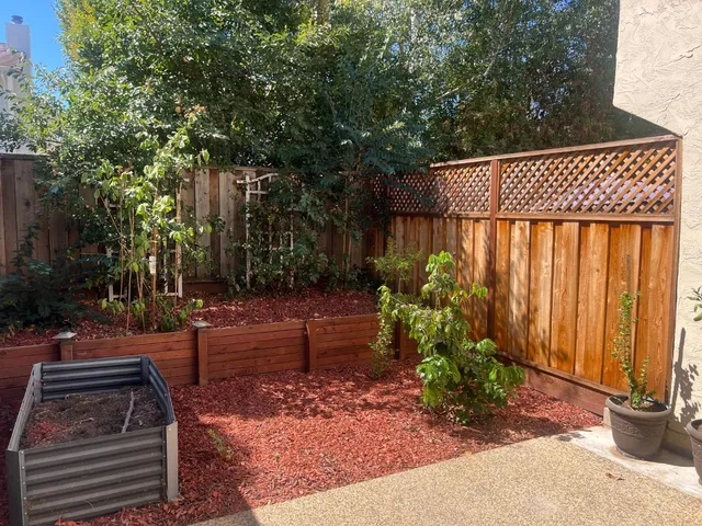 a view of balcony with potted plants