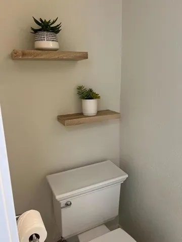 a view of hallway with livingroom and furniture