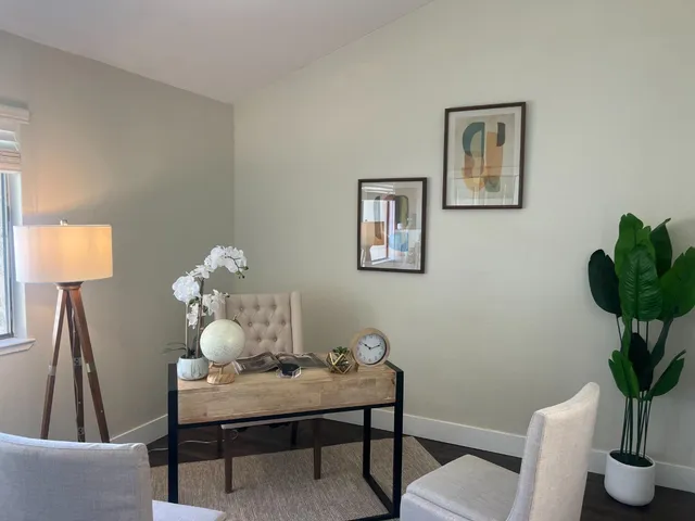 a living room with furniture and a window