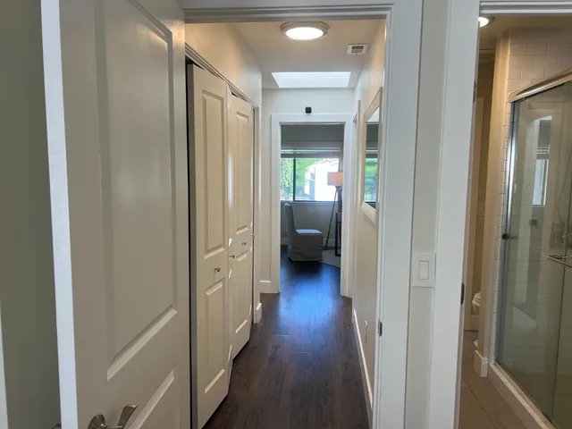 a view of a white house with a yard