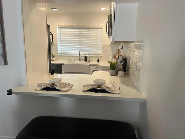 a kitchen with a stove and a microwave