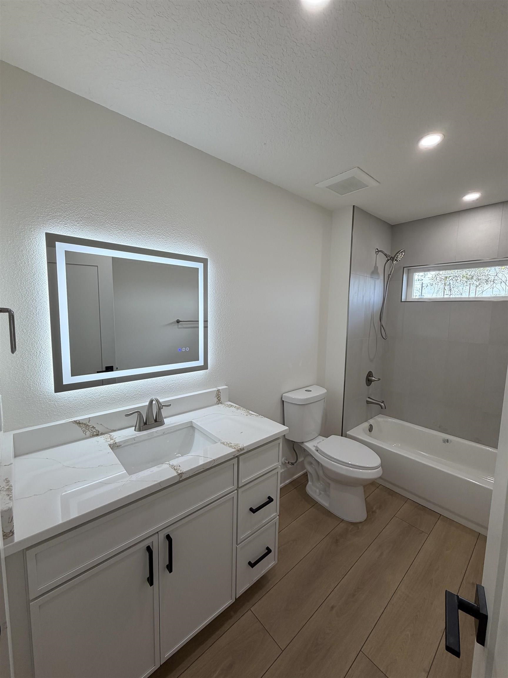 149 Dory Road St. Augustine South, FL 32086 - Photo 11 of 12 a bathroom with a toilet sink double vanity and mirror
