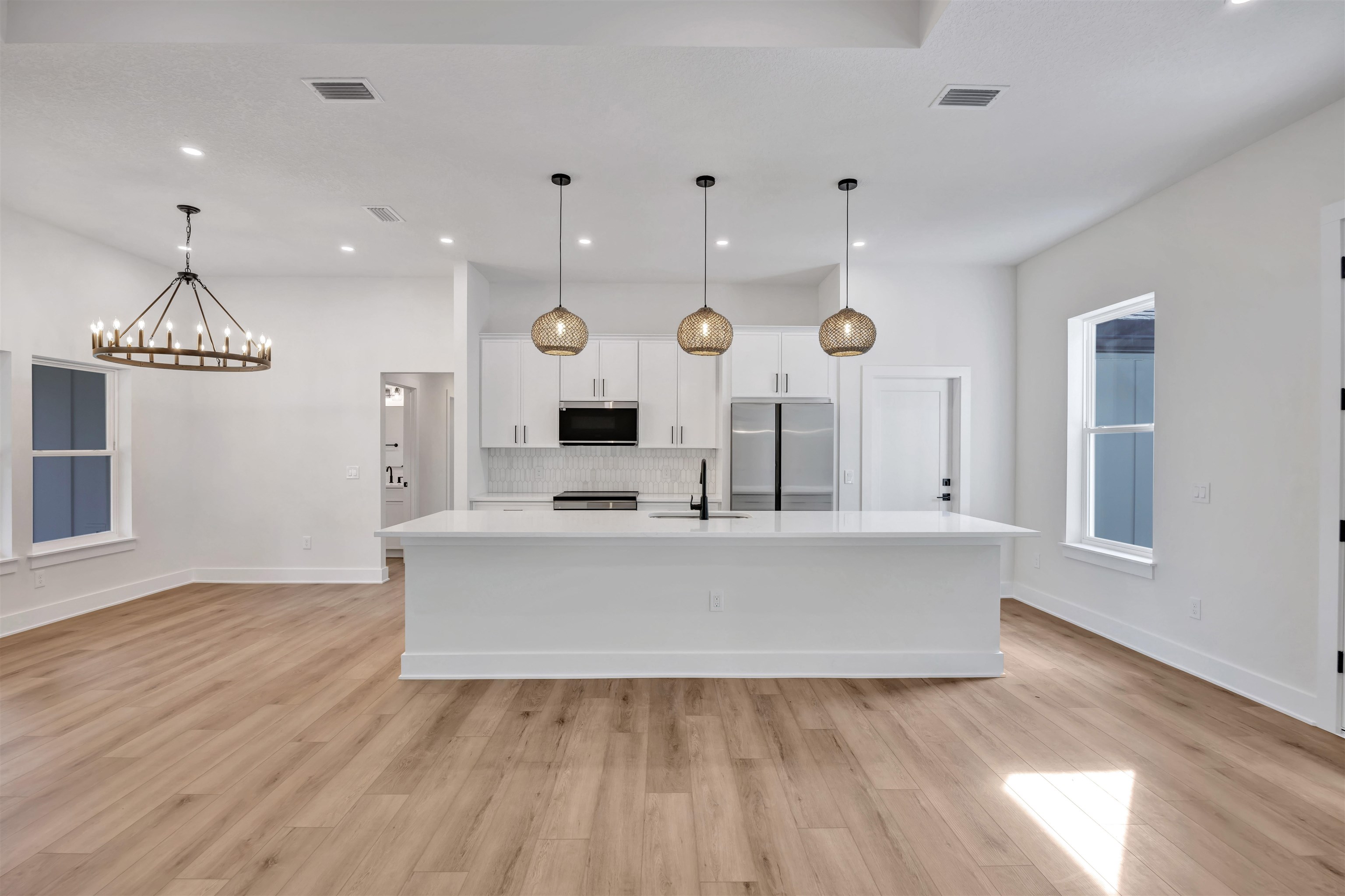 149 Dory Road St. Augustine South, FL 32086 - Photo 2 of 12 an open kitchen with wooden floor and window