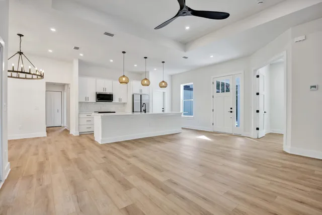 a view of kitchen with furniture and wooden floor
