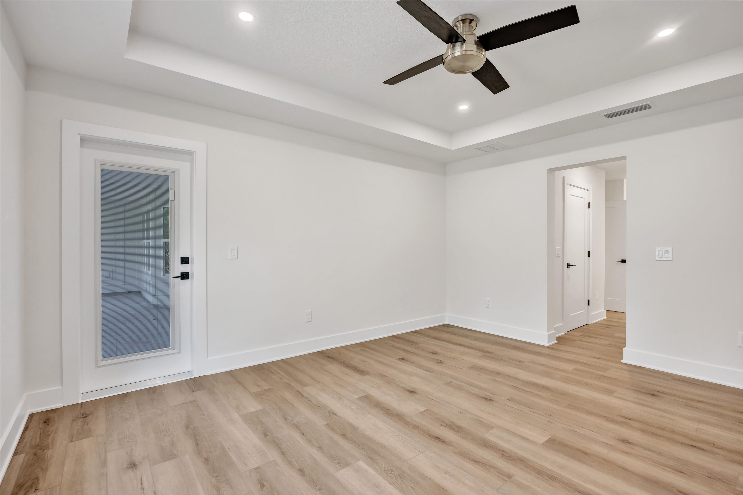 149 Dory Road St. Augustine South, FL 32086 - Photo 5 of 12 an empty room with wooden floor and windows