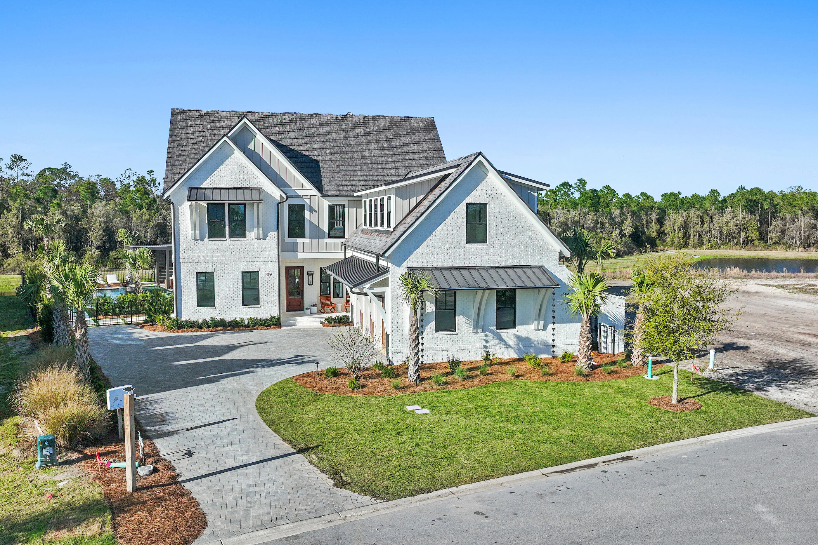 49 Sundew Pl Inlet Beach Inlet Beach, FL 32461 - Photo 95 of 108 a front view of a house with garden