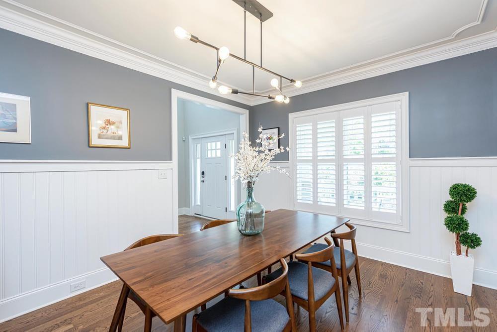 714 Edmund Street Raleigh, NC 27604 - Photo 3 of 30 Another view of the crown molding in the Dining Room and large front facing window.
