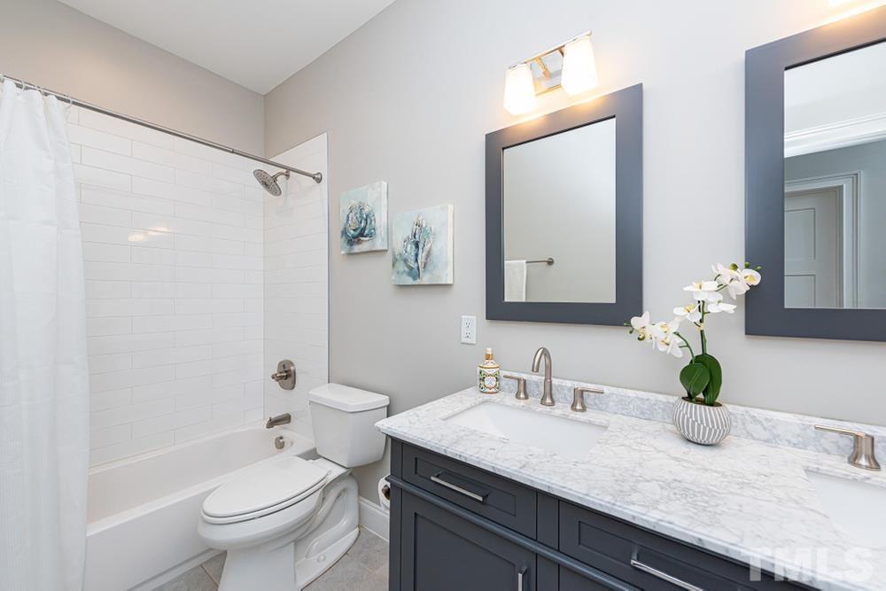 714 Edmund Street Raleigh, NC 27604 - Photo 22 of 30 Full Bathroom on upper level with tub/shower.