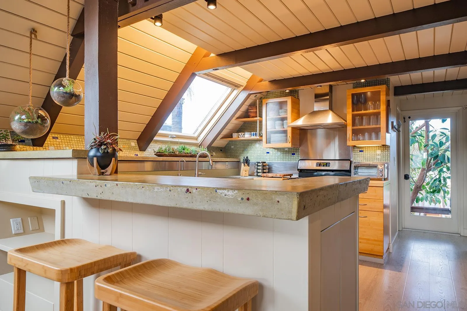 843 Neptune Avenue Encinitas, CA 92024 - Photo 11 of 49 a kitchen with a sink cabinets and wooden floor