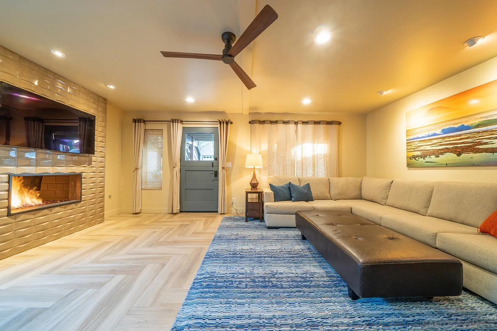 843 Neptune Avenue Encinitas, CA 92024 - Photo 14 of 49 a living room with furniture and a fireplace